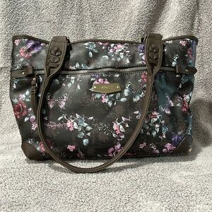 Brown purse with pink, purple and gray flowers and butterflies